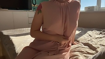 A Woman In A Fragile Pink Gown Indulges In Her Orifices