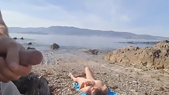 A Daring Exhibitionist Pleases A Nudist Milf With His Penis On The Beach